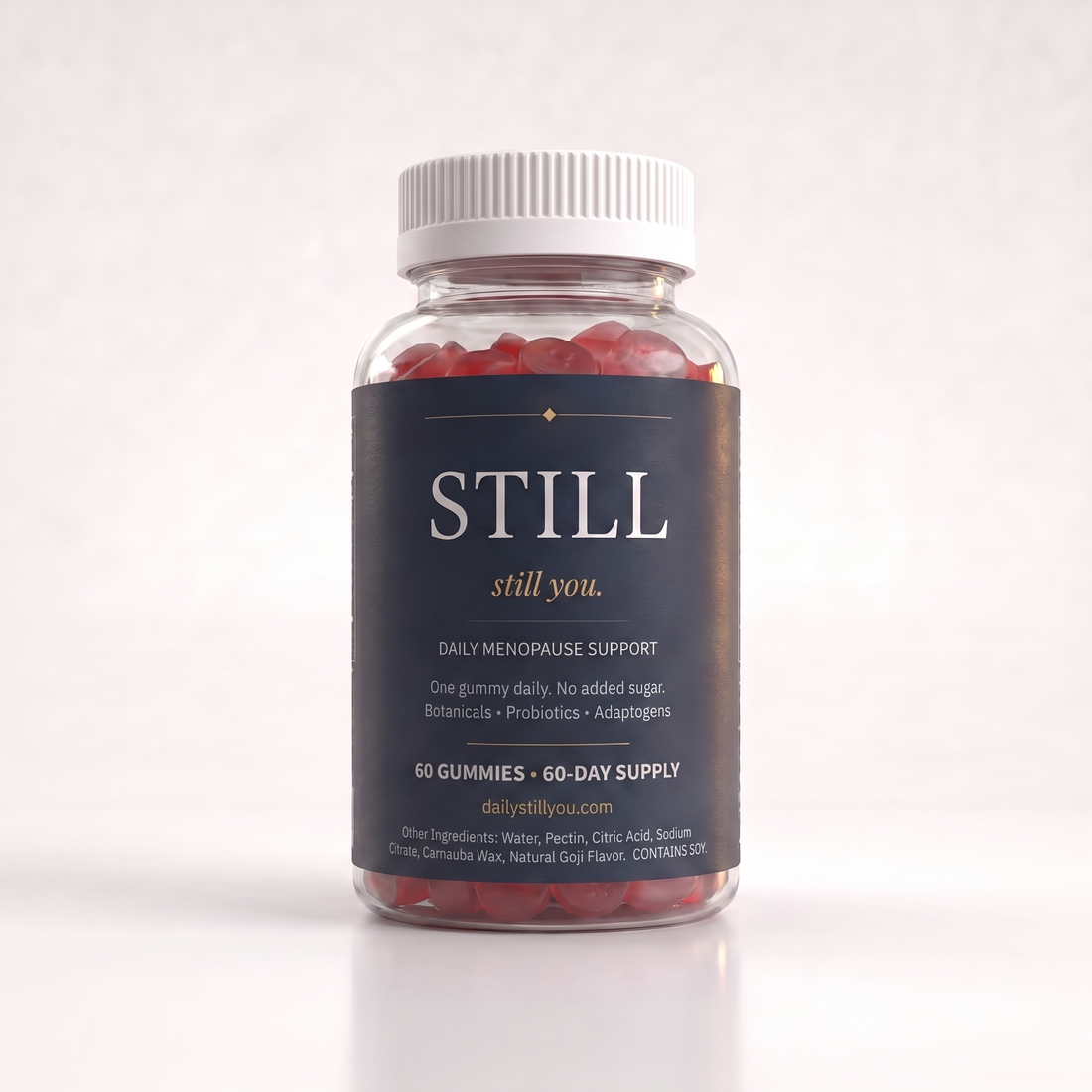 Still You Peri Night Gummies bottle beside ruby-red gummies on a cream studio background