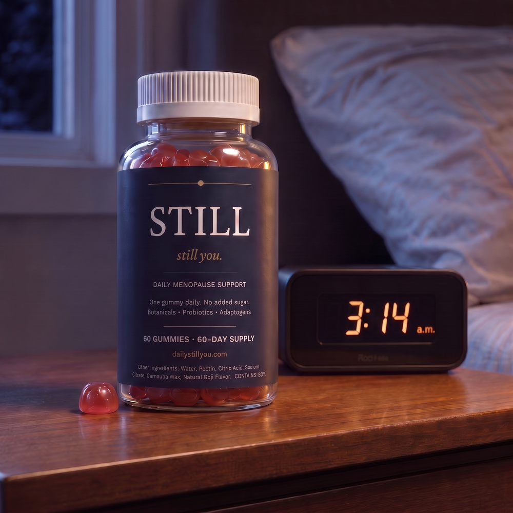 Still You Peri Night Gummies bottle on a nightstand beside an alarm clock reading 3:14 a.m.