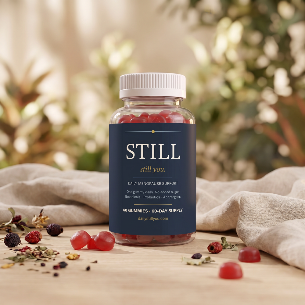 Still You bottle surrounded by botanical ingredients
